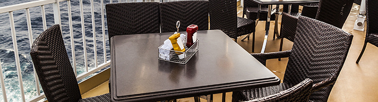 Cruise ship deck closeup of table and chairs